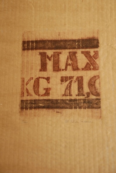 Vintage weight measurement stamp on wood — print on found material by Elisa Sassera