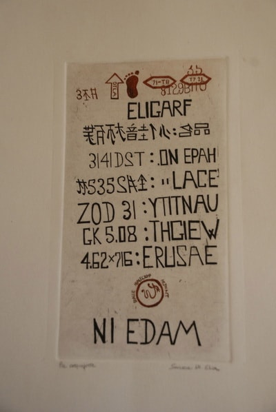 Vintage letterpress print with mixed text characters and typographic marks — Elisa Sassera